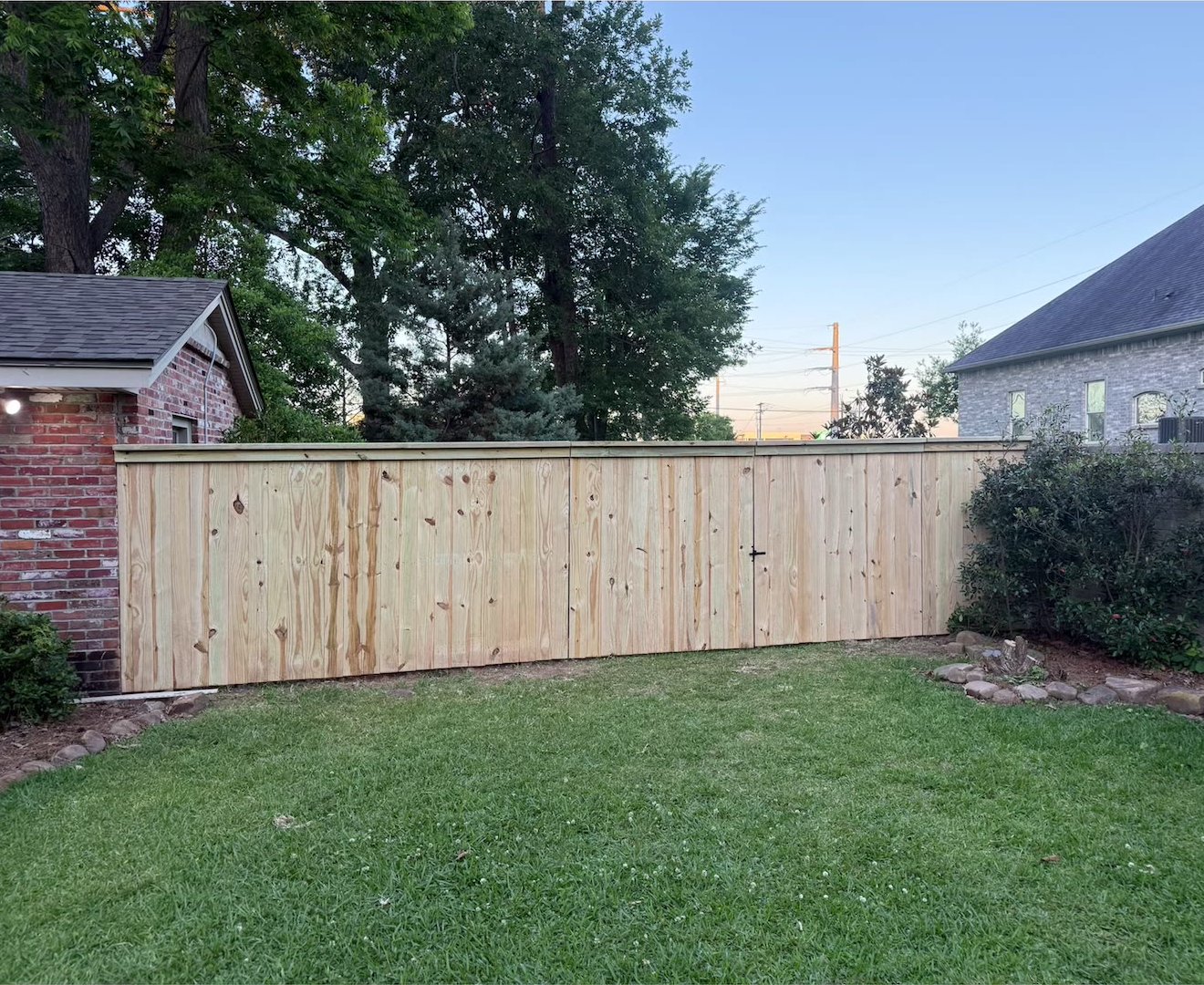 Wood Fence at Brick Home
